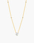 Gold necklace with a diamond pendant on a white background